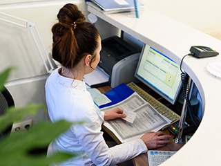 Receptionist at a computer
