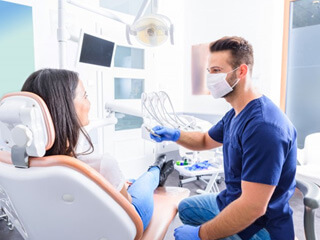 a dentist providing dental implant salvage treatment