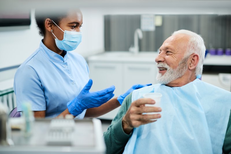person asking dentist how to get rid of denture sores